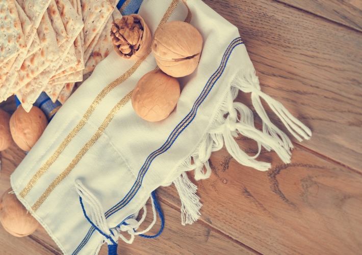 matza, tallit, and walnuts on table
